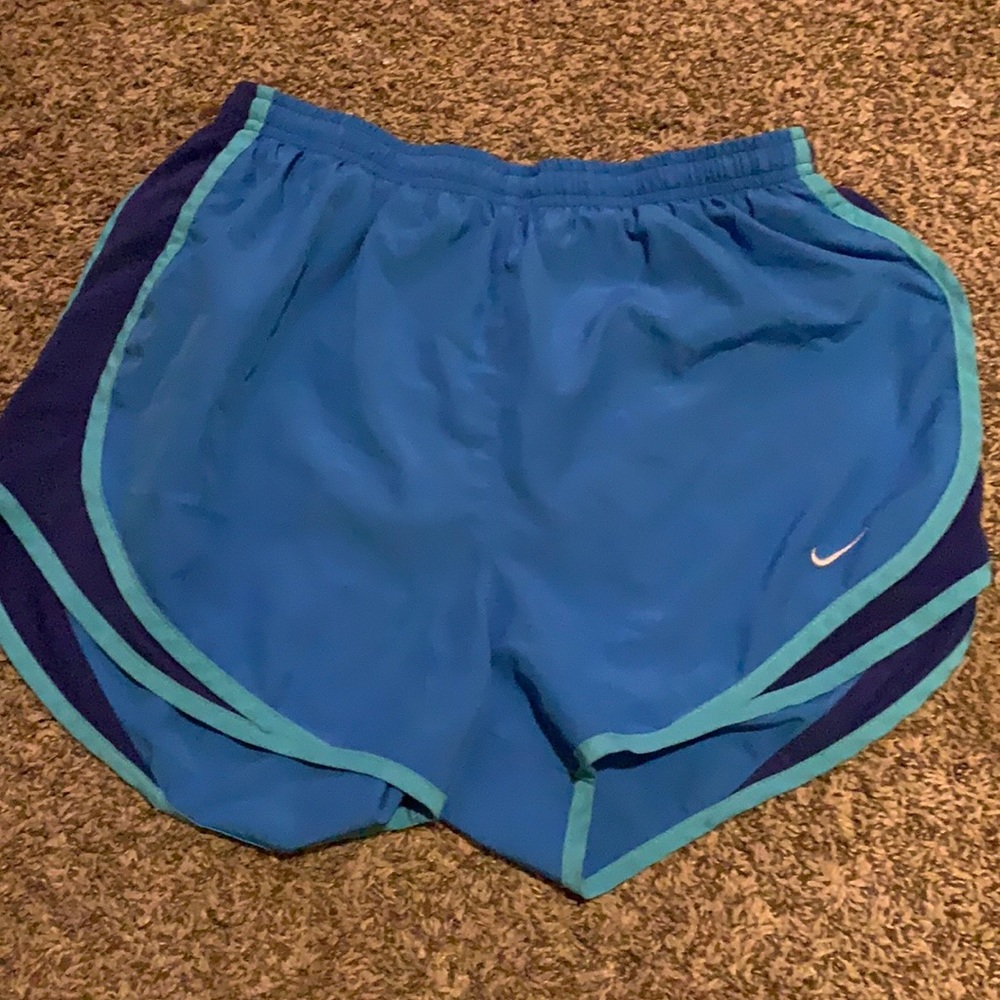 Blue Nike running shorts